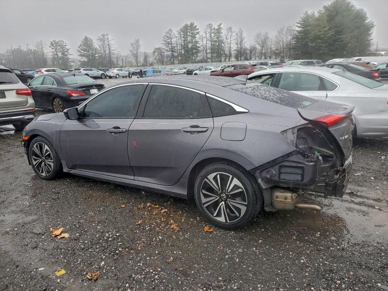 Photo 2 from auction – 2016 HONDA CIVIC EX with VIN 2HGFC1F42GH637495