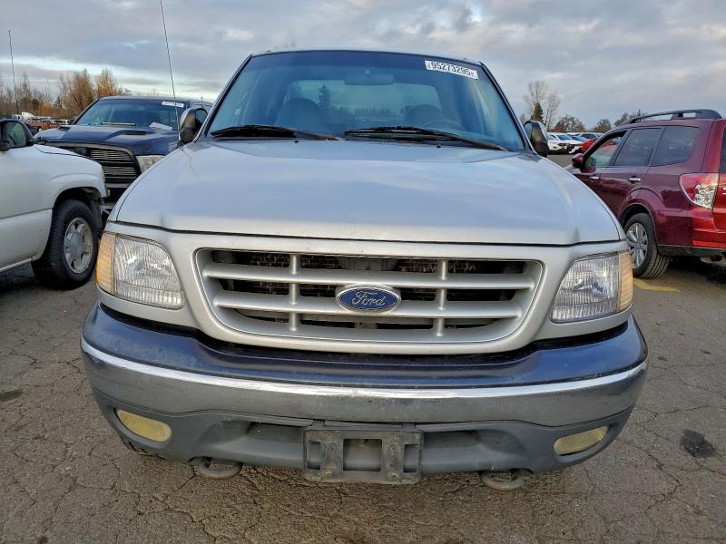 Photo 5 from auction – 1999 FORD F150 with VIN 1FTRX18L5XNB12605