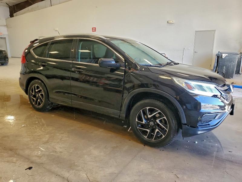Photo 4 from auction – 2016 HONDA CR-V SE with VIN 2HKRM3H4XGH559394