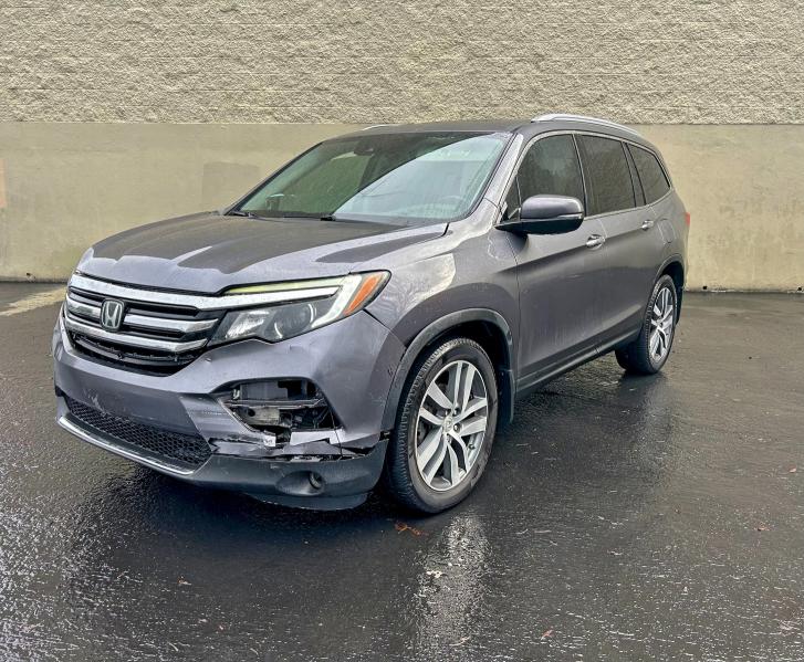 Photo 2 from auction – 2016 HONDA PILOT TOUR with VIN 5FNYF5H95GB044671