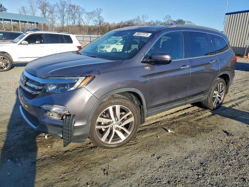 HONDA PILOT TOUR 2016 with VIN 5FNYF6H98GB114041 - Photo from auction