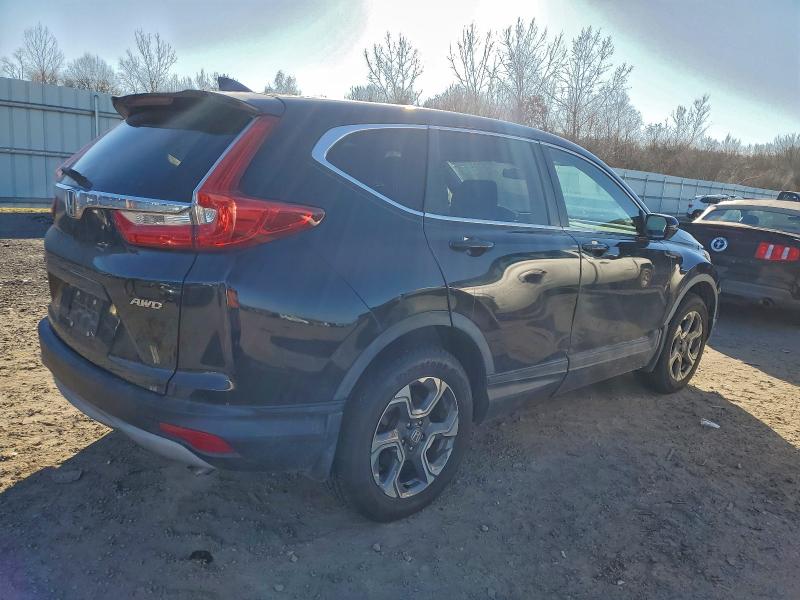 Photo 3 from auction – 2018 HONDA CR-V with VIN 7FARW2H53JE071119