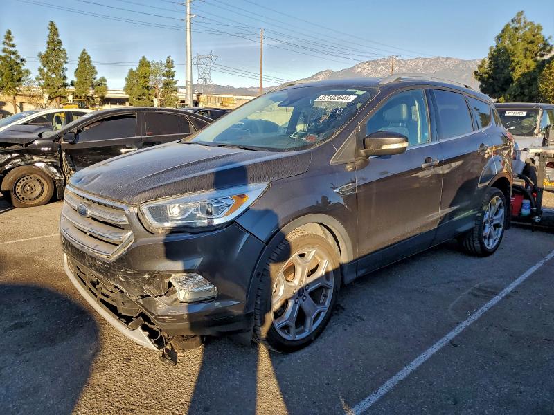 FORD ESCAPE TIT 2017 with VIN 1FMCU9J96HUD32947 - Photo from auction
