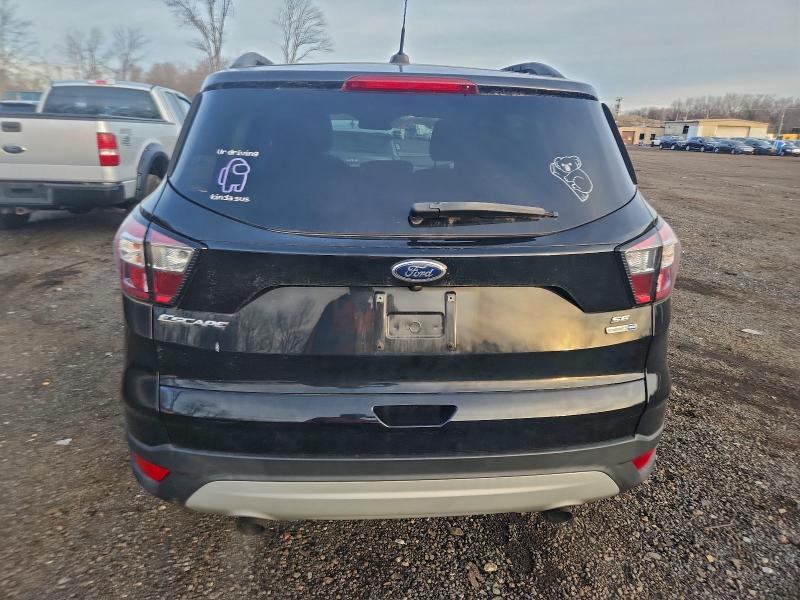 Photo 6 from auction – 2018 FORD ESCAPE SE with VIN 1FMCU9GD3JUC25422