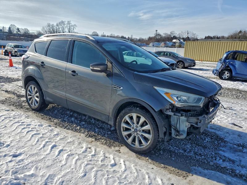 Photo 4 from auction – 2017 FORD ESCAPE TIT with VIN 1FMCU9J99HUA59325