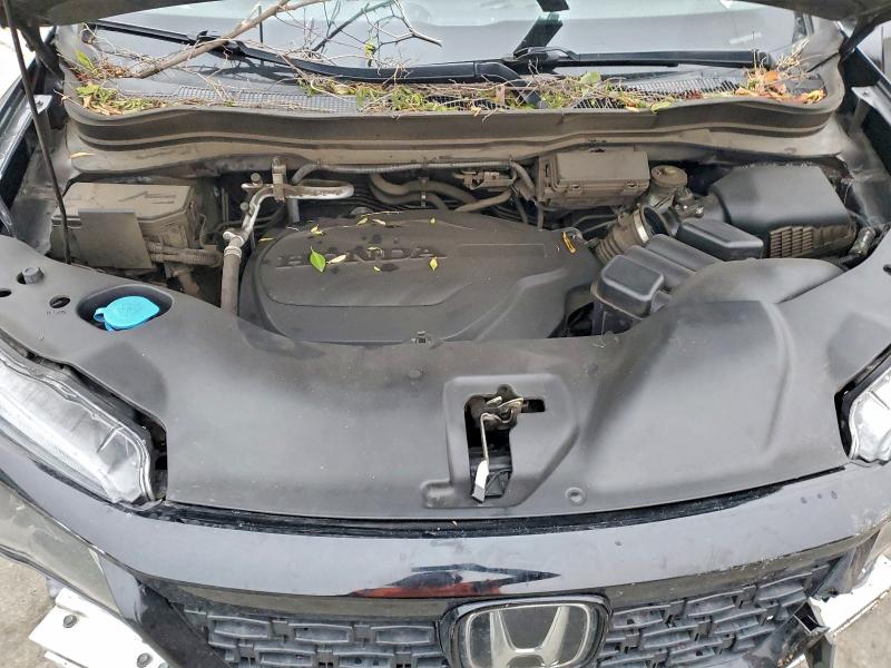 Photo 12 from auction – 2021 HONDA PASSPORT E with VIN 5FNYF7H5XMB000671