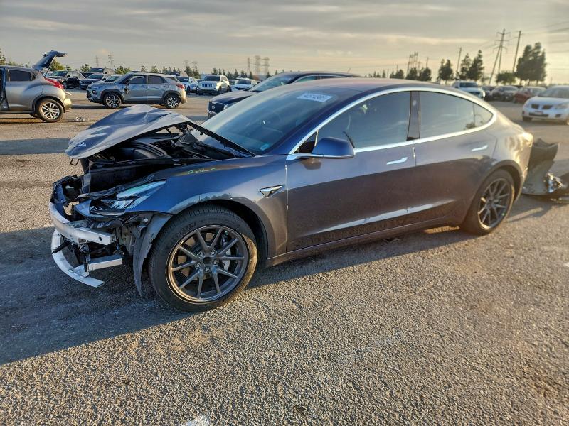 TESLA MODEL 3 2018 with VIN 5YJ3E1EA9JF014049 - Photo from auction