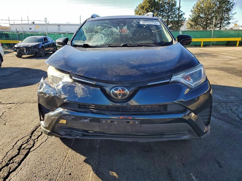 Photo 5 from auction – 2018 TOYOTA RAV4 LE with VIN JTMBFREV7JJ729415