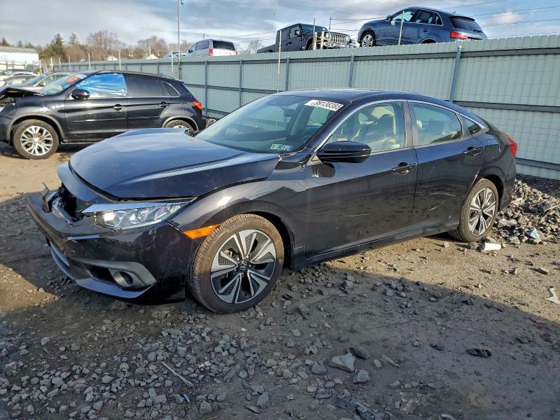 HONDA CIVIC EX 2018 with VIN JHMFC1F44JX011916 - Photo from auction