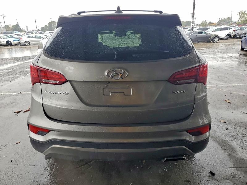 Photo 6 from auction – 2017 HYUNDAI SANTA FE S with VIN 5NMZU3LB0HH016589
