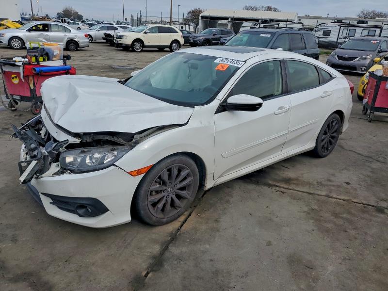 HONDA CIVIC EX 2018 with VIN JHMFC1F31JX037297 - Photo from auction