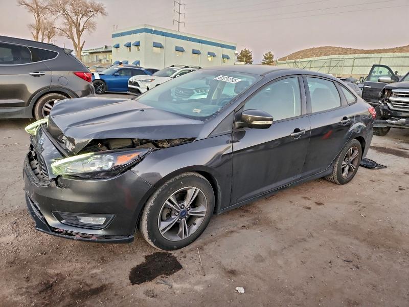 FORD FOCUS SE 2018 with VIN 1FADP3FE4JL228977 - Photo from auction