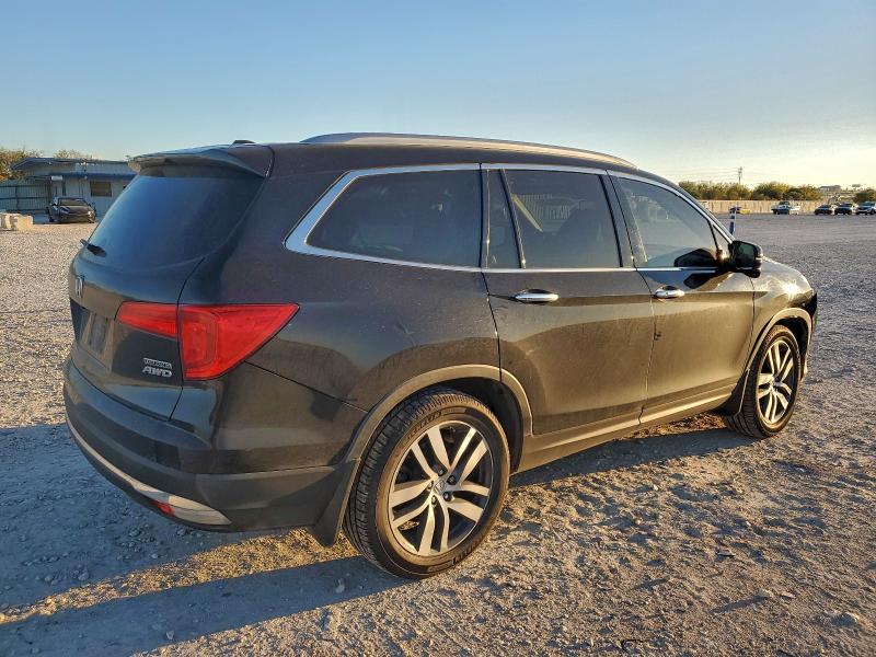 Photo 3 from auction – 2017 HONDA PILOT TOUR with VIN 5FNYF6H9XHB085885