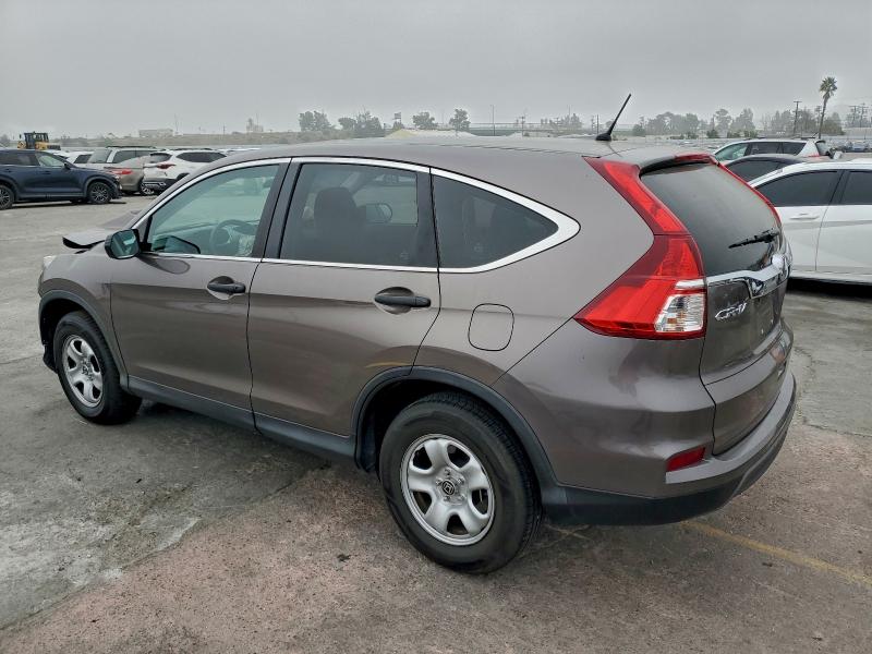 Photo 2 from auction – 2015 HONDA CR-V LX with VIN 3CZRM3H34FG702817