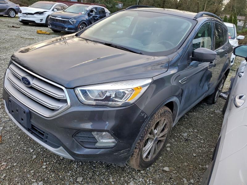 FORD ESCAPE 2018 with VIN 1FMCU9HD8JUD24560 - Photo from auction