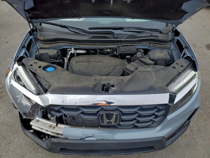 Photo 12 from auction – 2023 HONDA PASSPORT E with VIN 5FNYF8H53PB010923