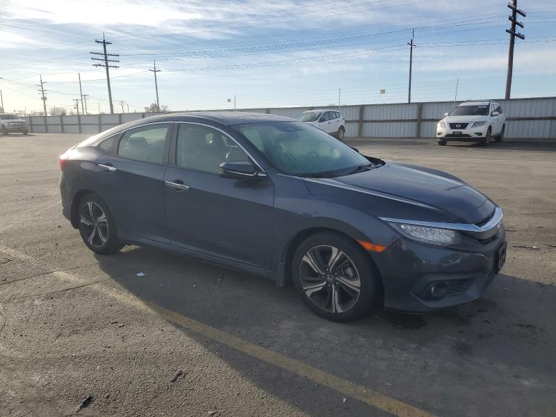 Photo 4 from auction – 2018 HONDA CIVIC TOUR with VIN JHMFC1F99JX040100
