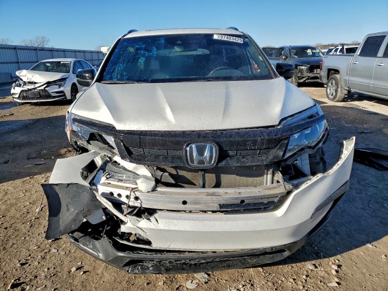 Photo 5 from auction – 2022 HONDA PILOT TRAI with VIN 5FNYF6H84NB057115