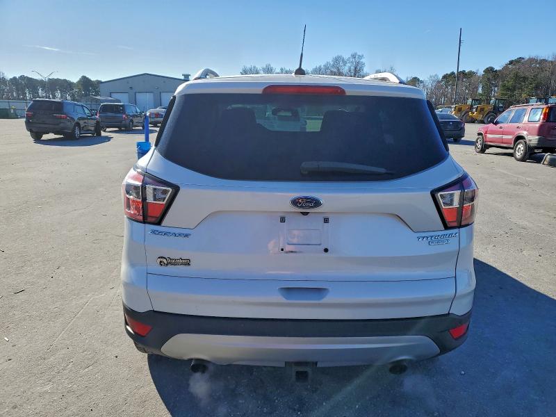Photo 6 from auction – 2017 FORD ESCAPE TIT with VIN 1FMCU0J99HUC06884