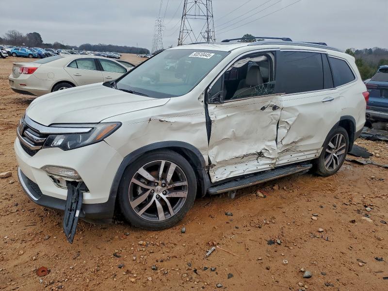 HONDA PILOT ELIT 2017 with VIN 5FNYF6H05HB100018 - Photo from auction