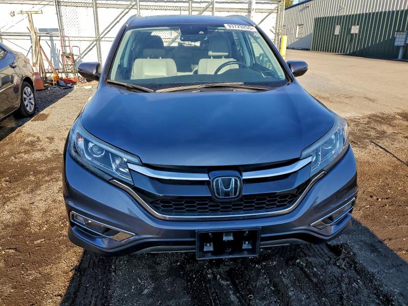 Photo 5 from auction – 2016 HONDA CRV with VIN 5J6RM4H98GL079863