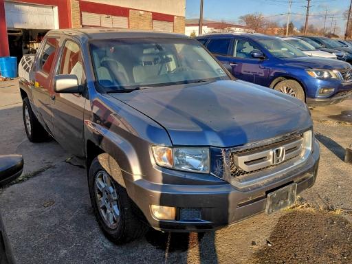 HONDA RIDGELINE 2010 with VIN 5FPYK1F40AB007571 - Photo from auction
