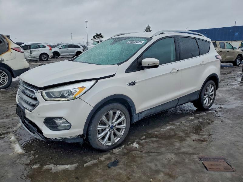FORD ESCAPE TIT 2017 with VIN 1FMCU9JD8HUD74329 - Photo from auction