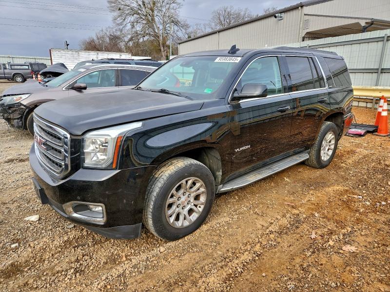 GMC YUKON SLT 2016 with VIN 1GKS2BKC6GR140828 - Photo from auction