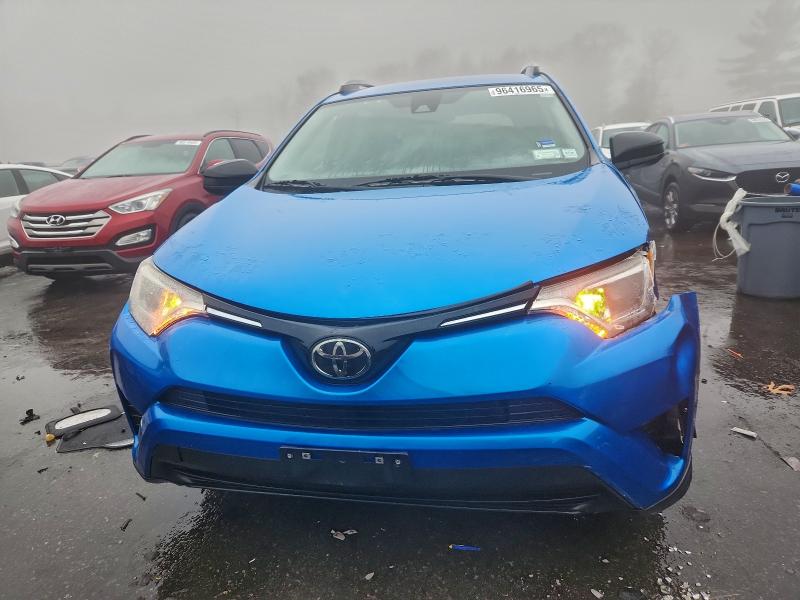 Photo 5 from auction – 2018 TOYOTA RAV4 LE with VIN JTMZFREV8JJ747713