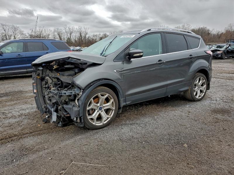 FORD ESCAPE TIT 2017 with VIN 1FMCU9J90HUC70784 - Photo from auction