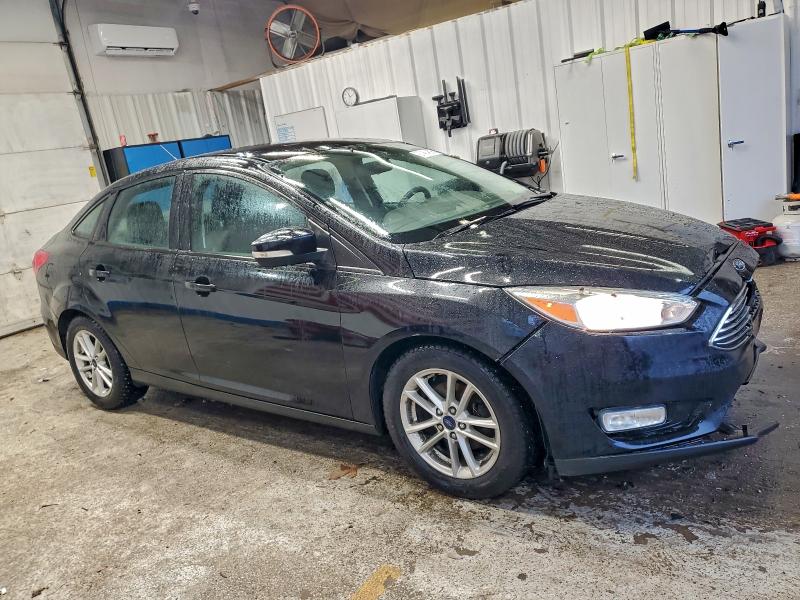 Photo 4 from auction – 2016 FORD FOCUS with VIN 1FADP3F28GL396619
