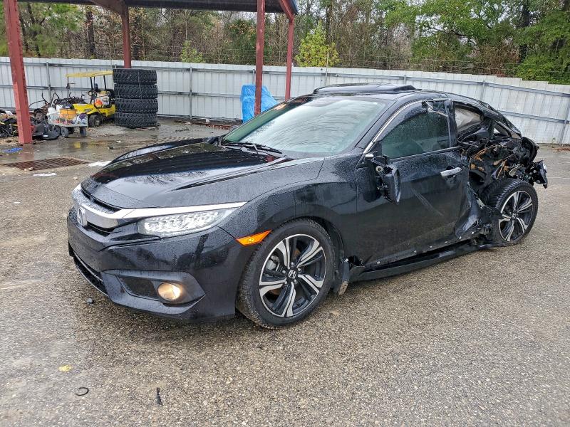 HONDA CIVIC TOUR 2016 with VIN 19XFC1F91GE017453 - Photo from auction