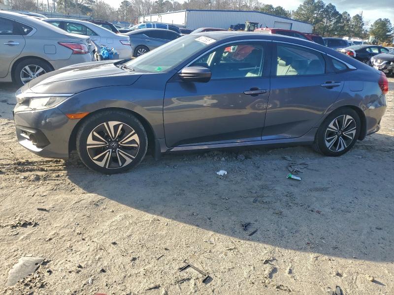 HONDA CIVIC EXL 2017 with VIN 19XFC1F7XHE011764 - Photo from auction