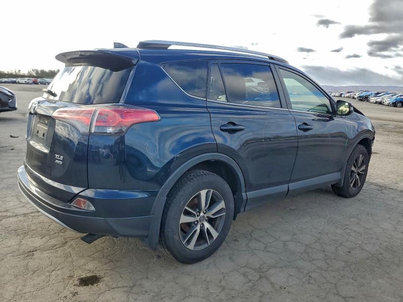 Photo 3 from auction – 2017 TOYOTA RAV4 XLE with VIN JTMRFREV4HJ113356
