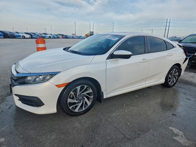 HONDA CIVIC EX 2018 with VIN 19XFC2F77JE038898 - Photo from auction