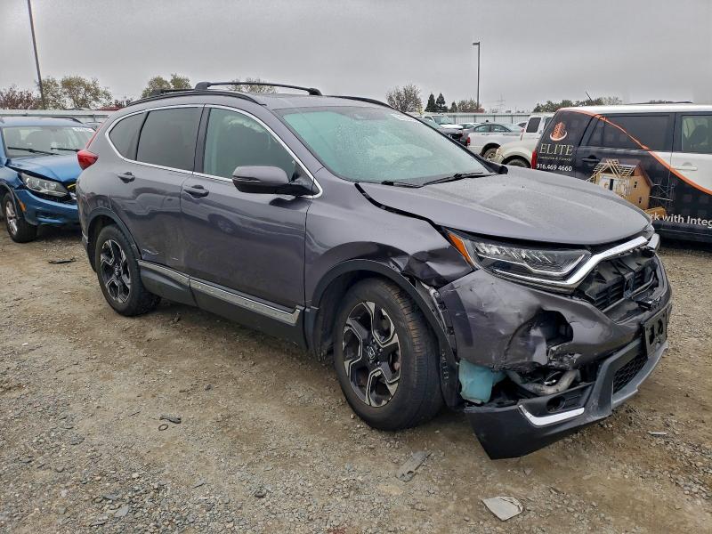 Photo 4 from auction – 2018 HONDA CR-V with VIN 7FARW2H96JE088581