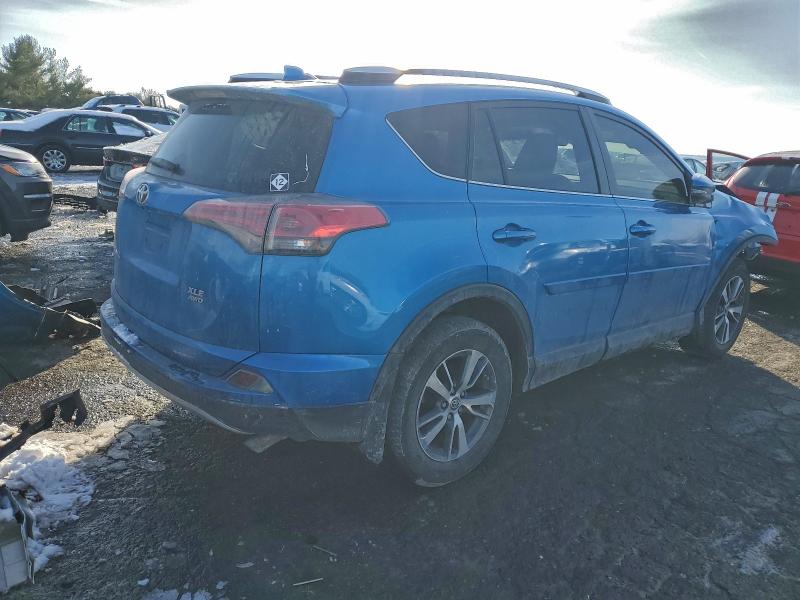 Photo 3 from auction – 2016 TOYOTA RAV4 XLE with VIN JTMRFREV3GD186361