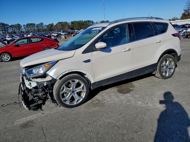 FORD ESCAPE TIT 2017 with VIN 1FMCU0J99HUC06884 - Photo from auction