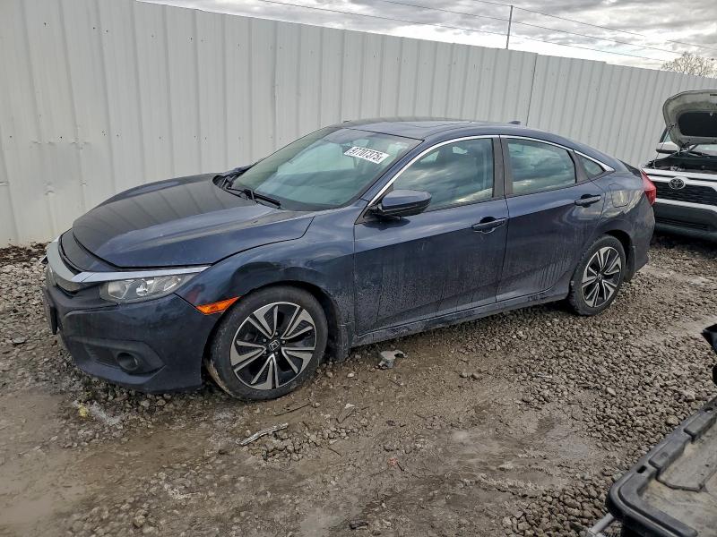 HONDA CIVIC EX 2017 with VIN 2HGFC1F40HH631115 - Photo from auction