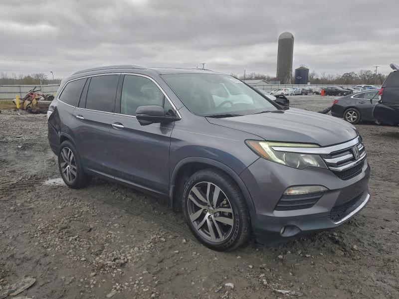 Photo 4 from auction – 2016 HONDA PILOT TOUR with VIN 5FNYF5H95GB049577