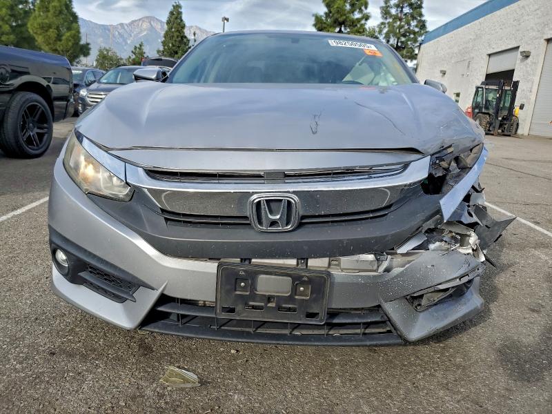 Photo 5 from auction – 2016 HONDA CIVIC EX with VIN 2HGFC1F35GH642195