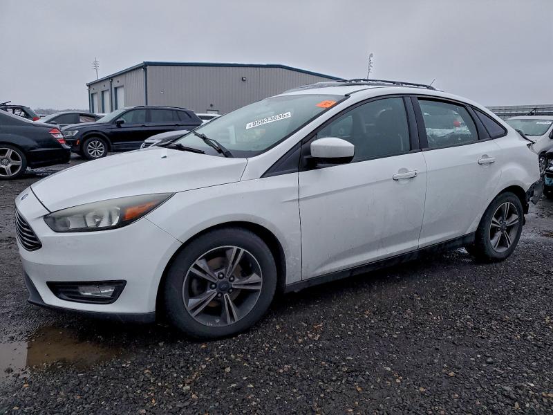 FORD FOCUS 2018 with VIN 1FADP3FE3JL201317 - Photo from auction
