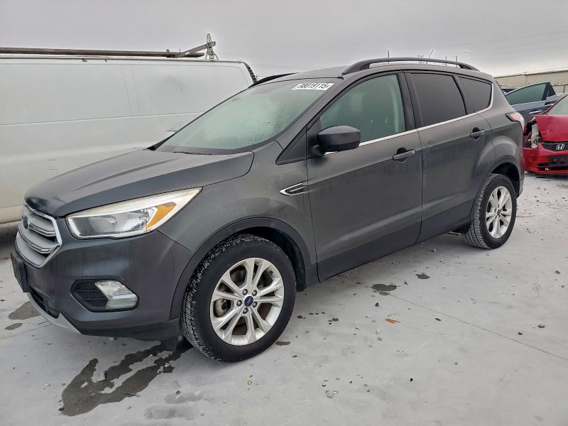 FORD ESCAPE SE 2018 with VIN 1FMCU0GD1JUA65780 - Photo from auction