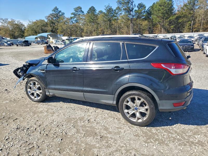Photo 2 from auction – 2014 FORD ESCAPE with VIN 1FMCU0JX3EUD48559