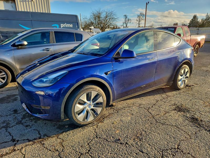 TESLA MODEL Y 2023 with VIN 7SAYGDEE9PF670946 - Photo from auction