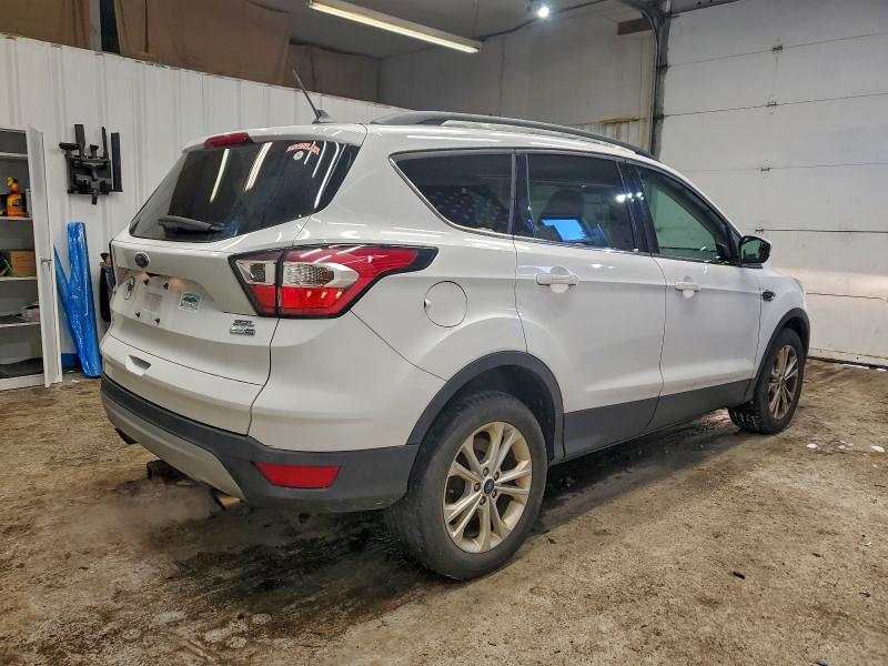 Photo 3 from auction – 2018 FORD ESCAPE with VIN 1FMCU9HD3JUA06135