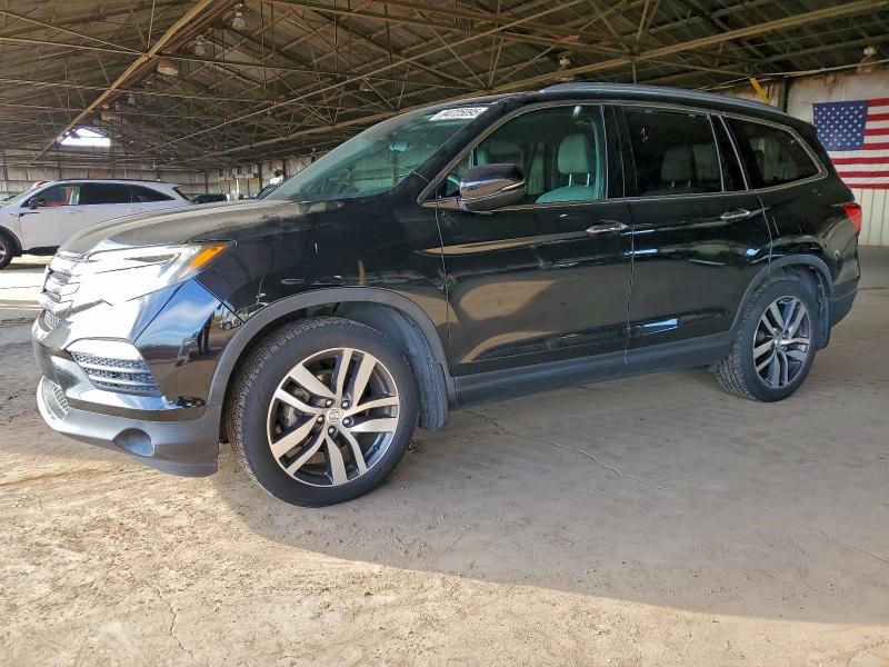 HONDA PILOT TOUR 2018 with VIN 5FNYF5H96JB012724 - Photo from auction