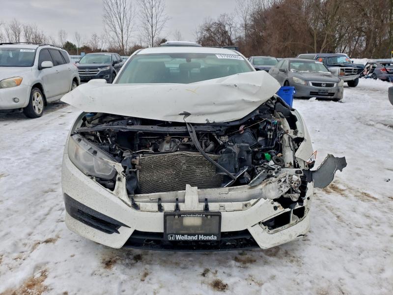 Photo 5 from auction – 2017 HONDA CIVIC LX with VIN 2HGFC2F52HH034773