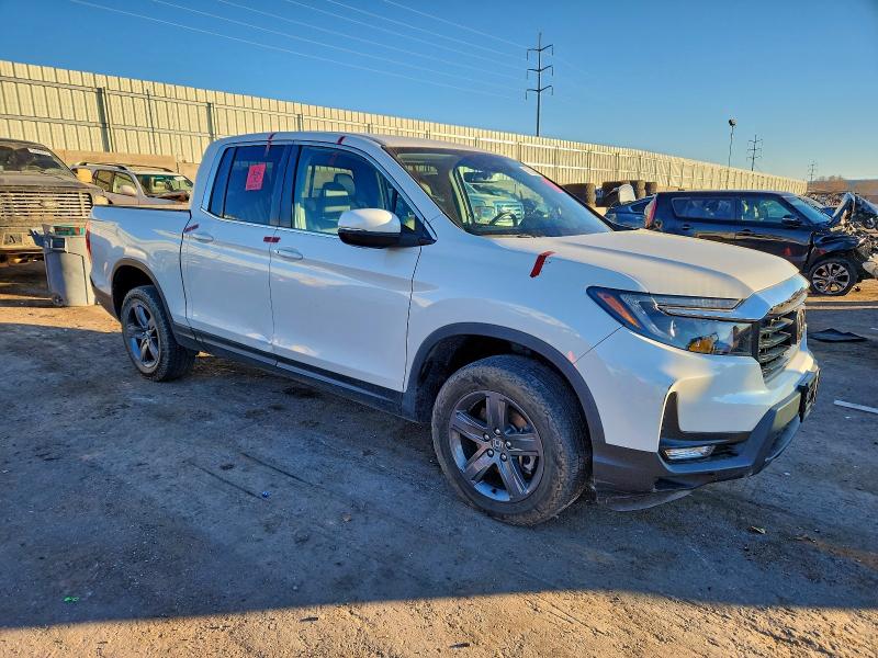 Photo 4 from auction – 2023 HONDA RIDGELINE with VIN 5FPYK3F50PB011875