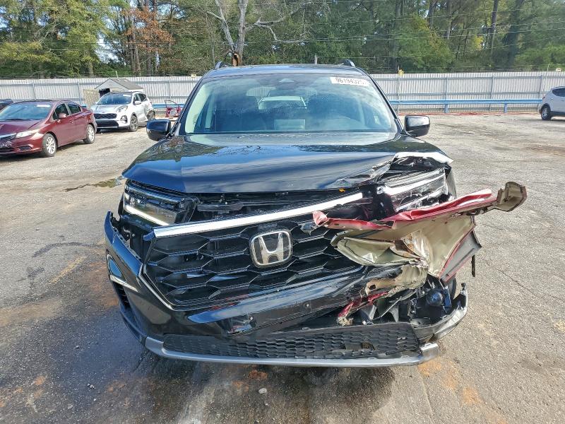 Photo 5 from auction – 2025 HONDA PILOT TOUR with VIN 5FNYG2H78SB030668